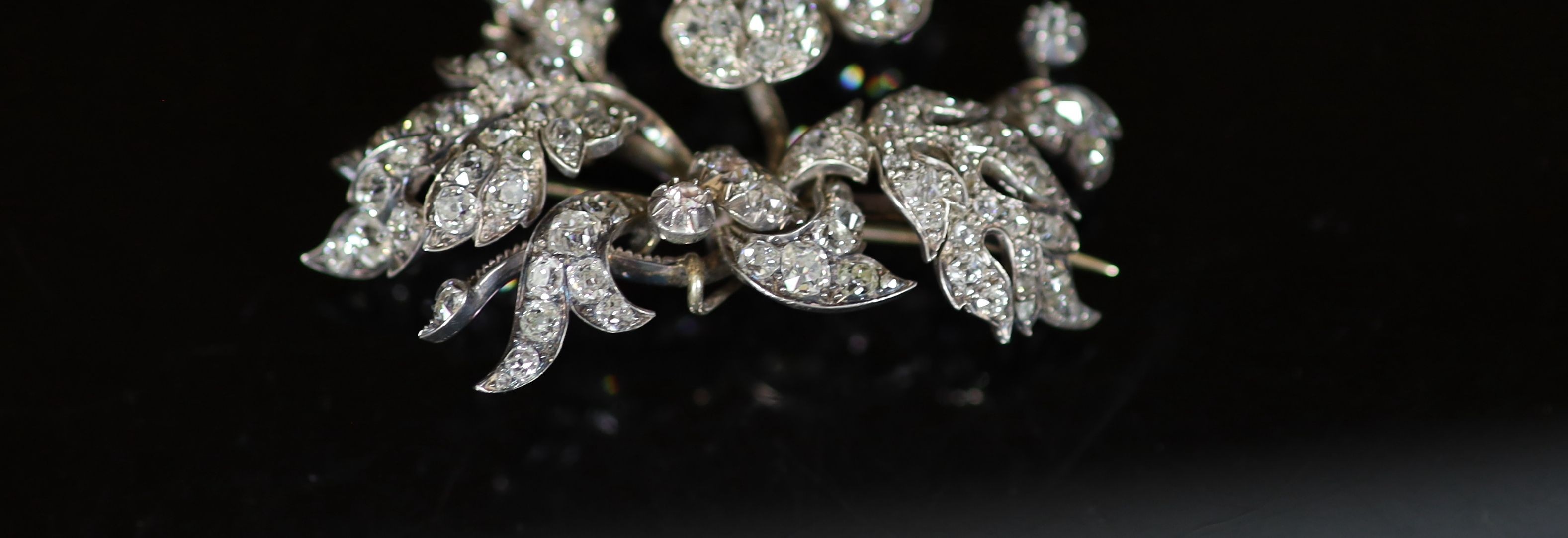 A Victorian gold, silver and diamond encrusted floral spray brooch